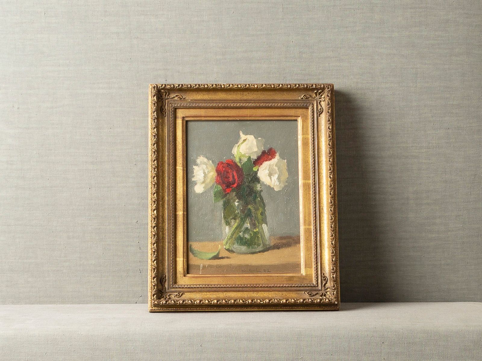 FULL-BLOWN RED AND WHITE ROSES IN A GLASS VASE BY ROBERT KULICKE