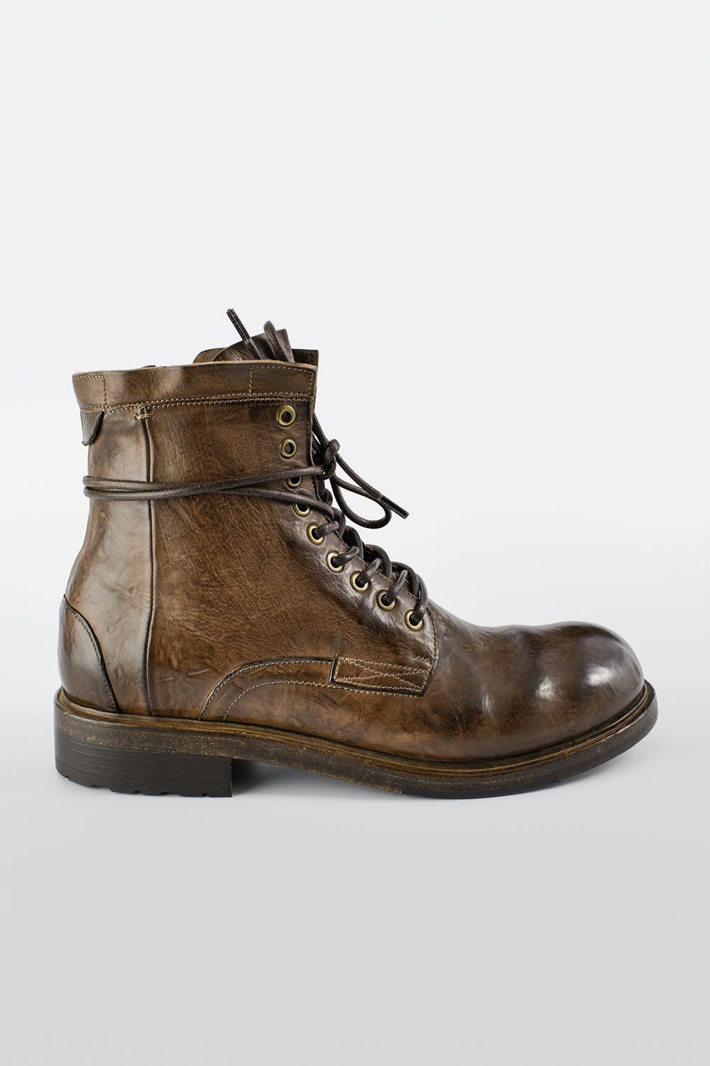 CURZON husk-brown military boots.
