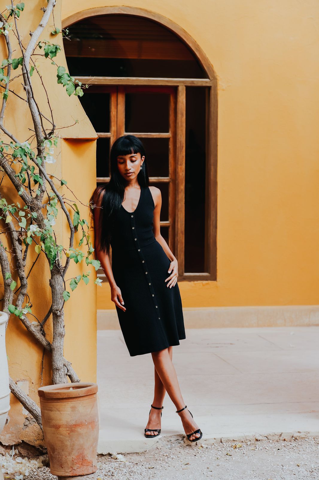 The Kōr Organic Cotton Ribbed Pinafore Dress in Black