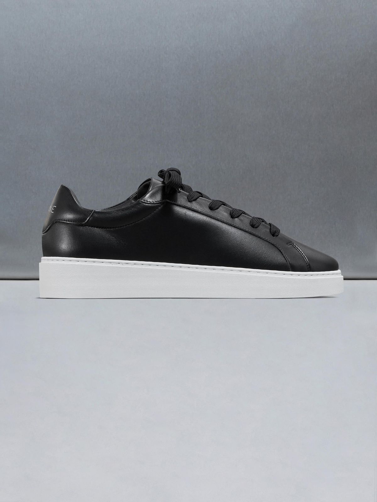 Mid Essential Leather Trainer in Black